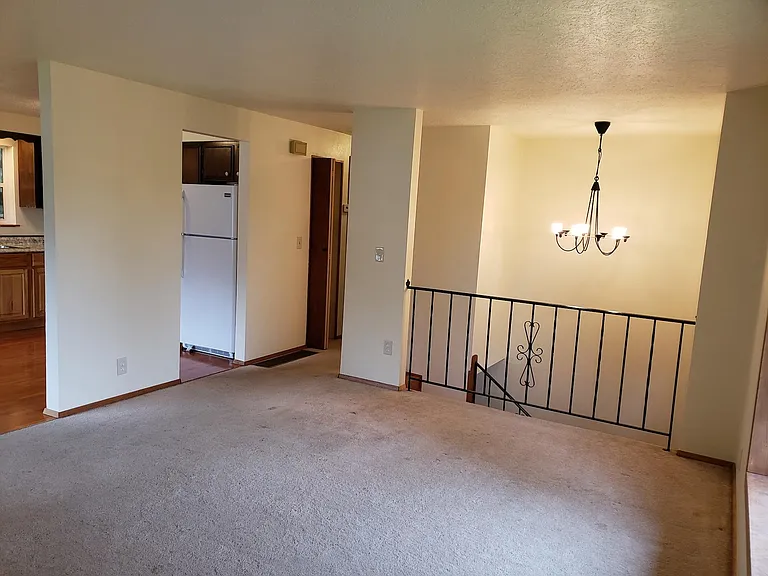living room leading to hallway and bedrooms