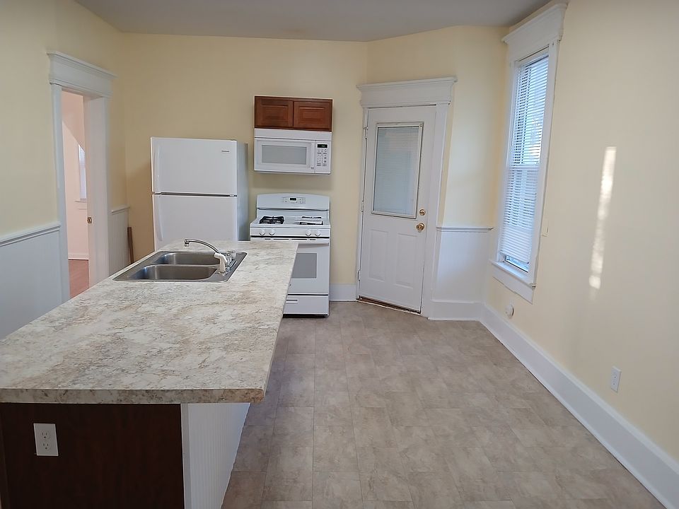 Large kitcheh with a very large pantry and storage room.