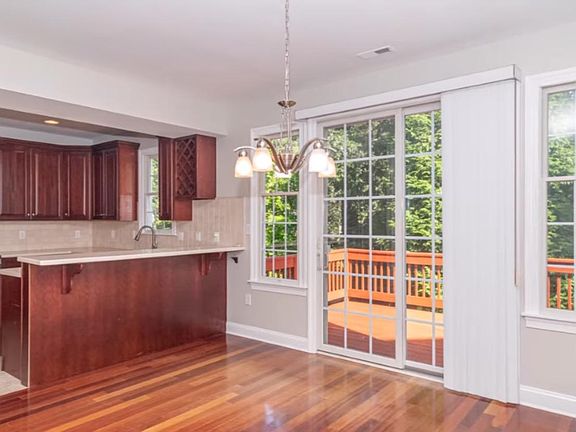 Kitchen with coffee bar sliding glass doors to outside deck