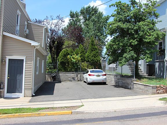 Second Street Side: Renter has Own Private Entrance to the Left and 2 Parking Spaces to the Right of the Driveway.
