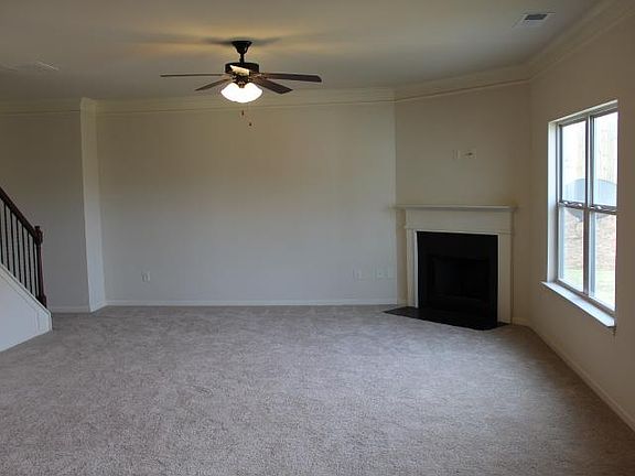 Family room w/ wood burning fireplace