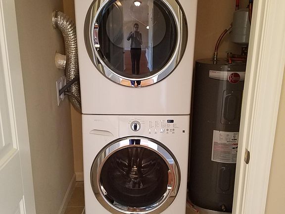 Full size laundry in apartment.