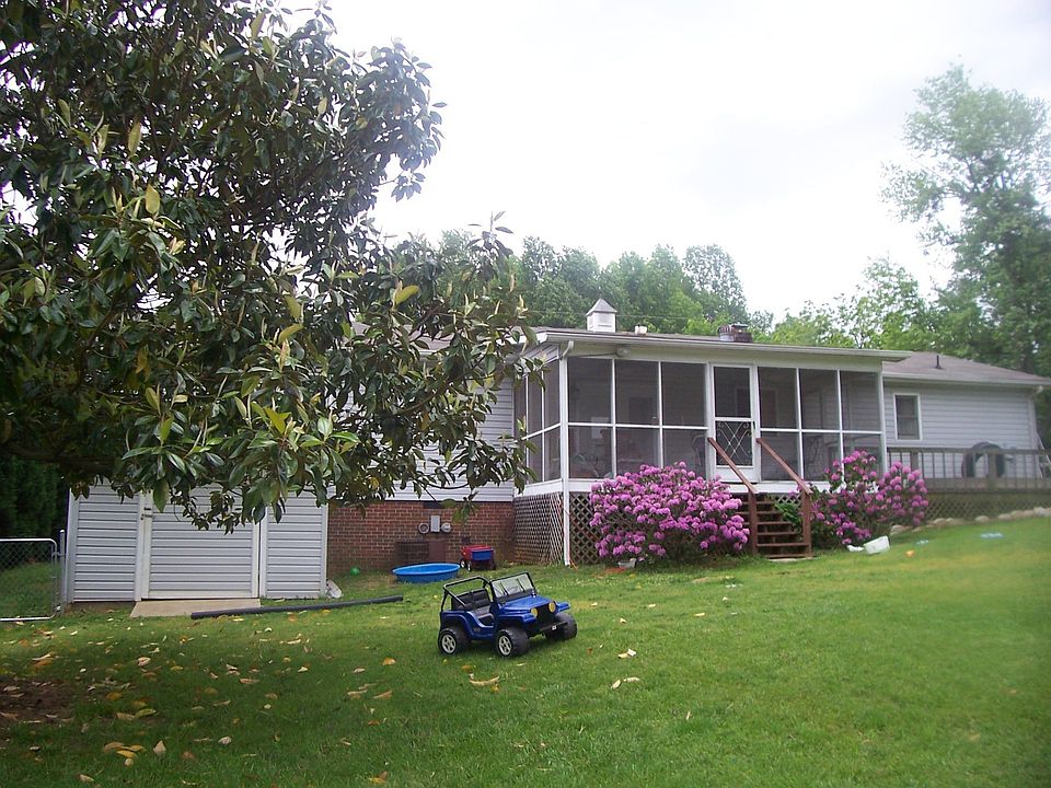 The back of house and screened in back patio.