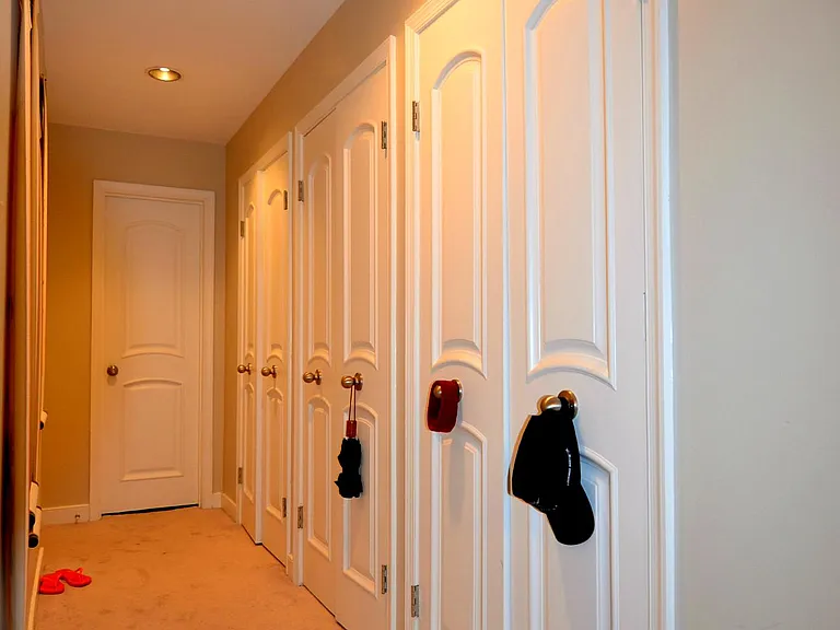 Hallway with abundant closet storage