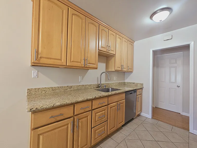 Maple cabinets with granite countertop, stainless steel sink