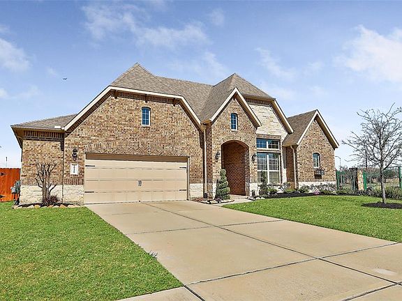 Four sided brick, well landscaped and freshly mulched. Inground sprinklers front and back. Garage door with decorative hardware. Front gutters. 2 front coach lights, and 30 year shingles. Cast stone address plaque.