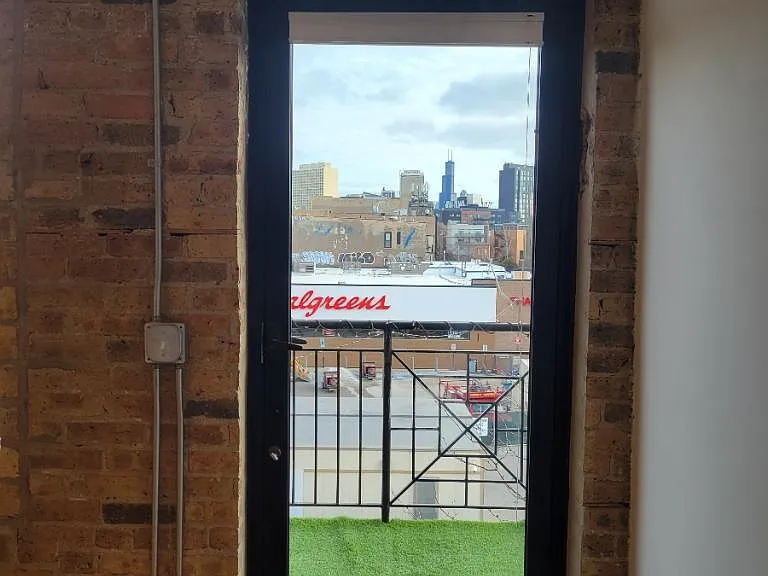 door to balcony with city views