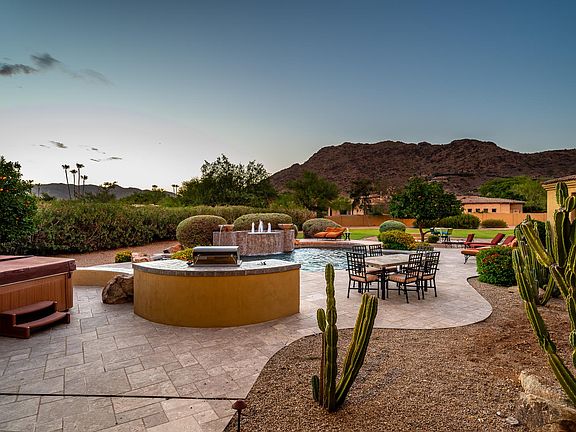 BUILT IN BBQ, THERAPEUTIC HOT TUB, POOL, WATER FEATURE, MOUNTAIN VIEWS & ABSOLUTE PRIVACY!