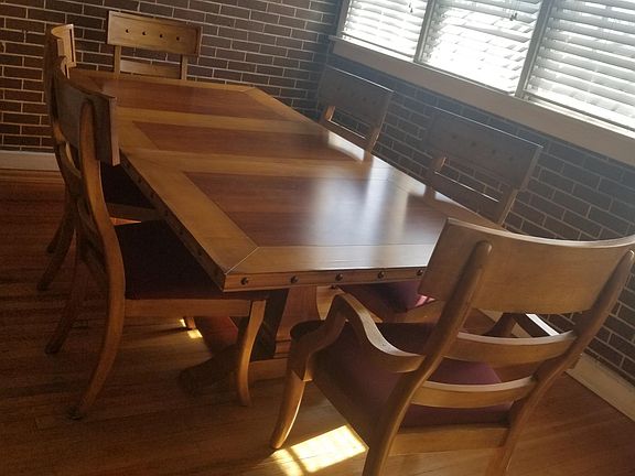 Sunroom is spacious enough for dinning room or large office space.