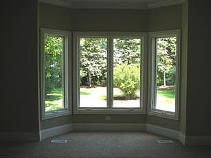 Bay window overlooking backyard