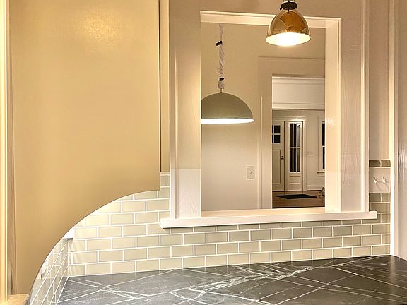 Soapstone countertops, Copper Pendant lamps.