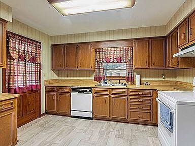 Large kitchen with new fridge and dishwasher