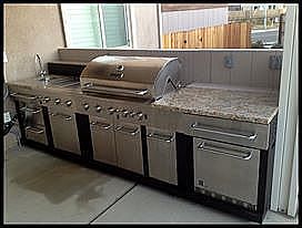 Outdoor kitchen with fridge and sink