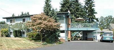 Level back yard with garden space and sprinkler system. Detached studio/shop. Lots of parking.