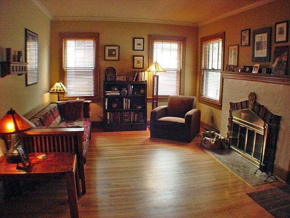 Rich in character, wood floors, cove moldings & fireplace!