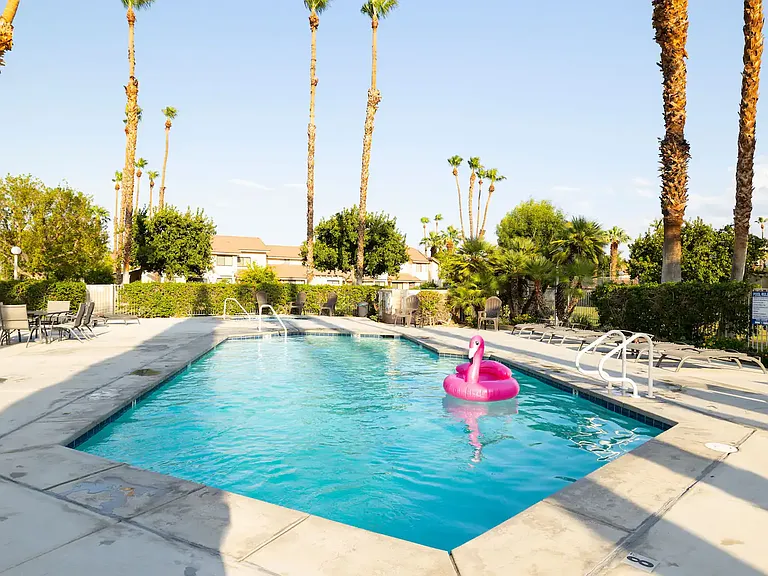 Main pool (1 of 6). Plenty of lounge chairs and tables. Beach towels and rafts available in condo.