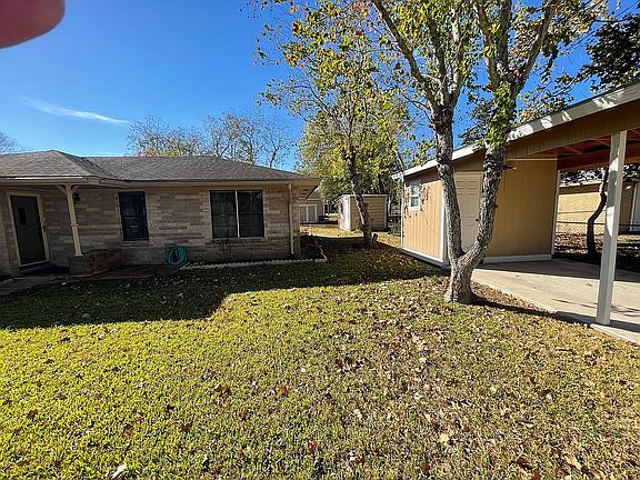 Front of house with carport 