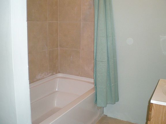 Master tiled extra long bathtub