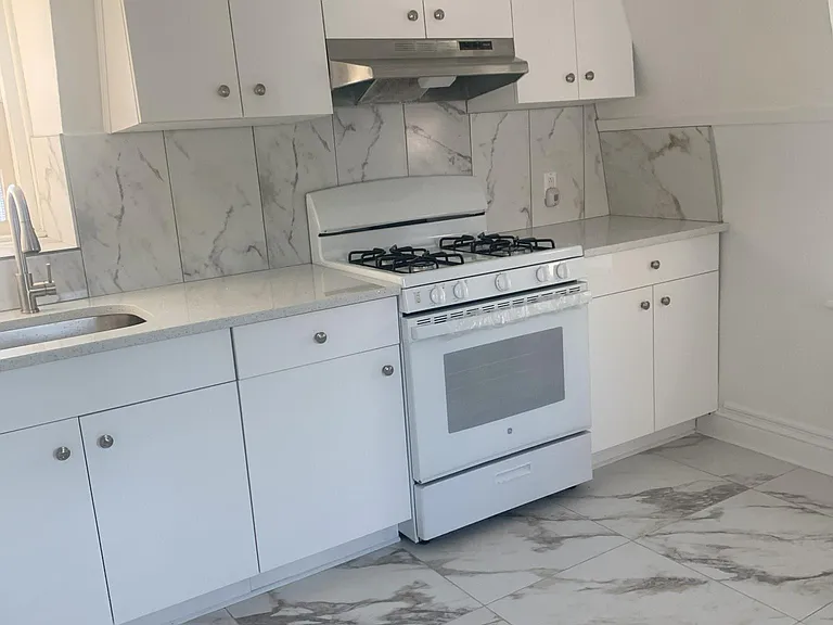 Large brand new kitchen. Brand new tiled floor!