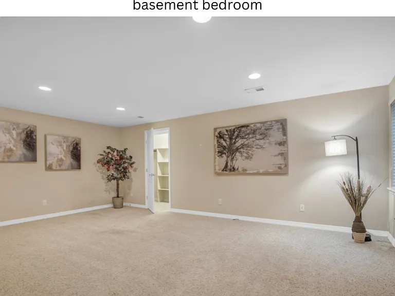Basement bedroom with walk in closet, attached laundry room, egressed window and 3/4 bathroom