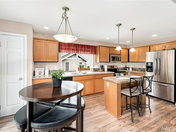 Breakfast nook adjoins kitchen.