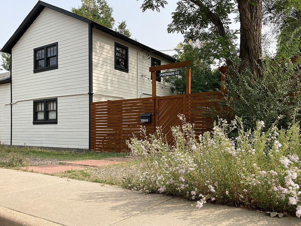 Gated entrance with plenty of parking and walking distance to grocery stores, shops and restaurants.