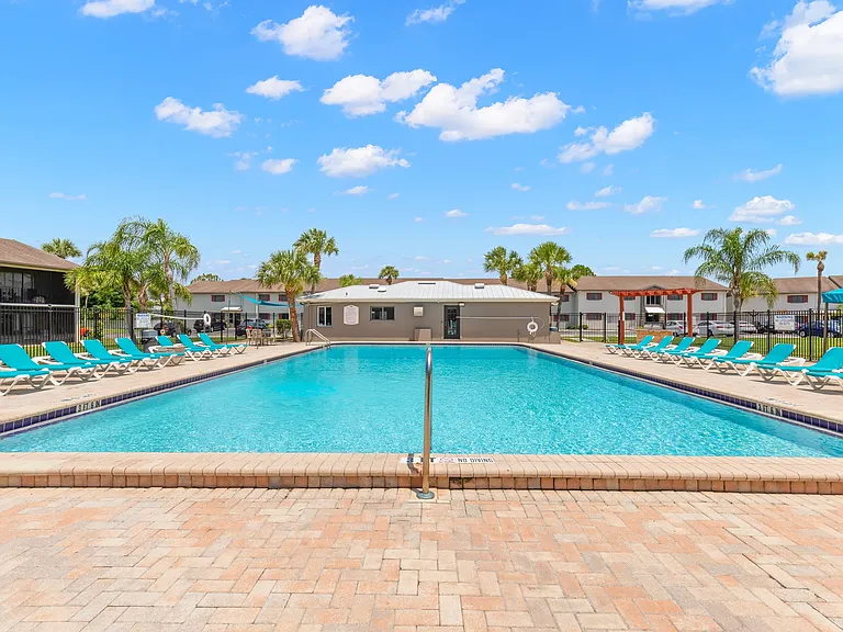 Sparkling Swimming Pool with Chaise Lounges