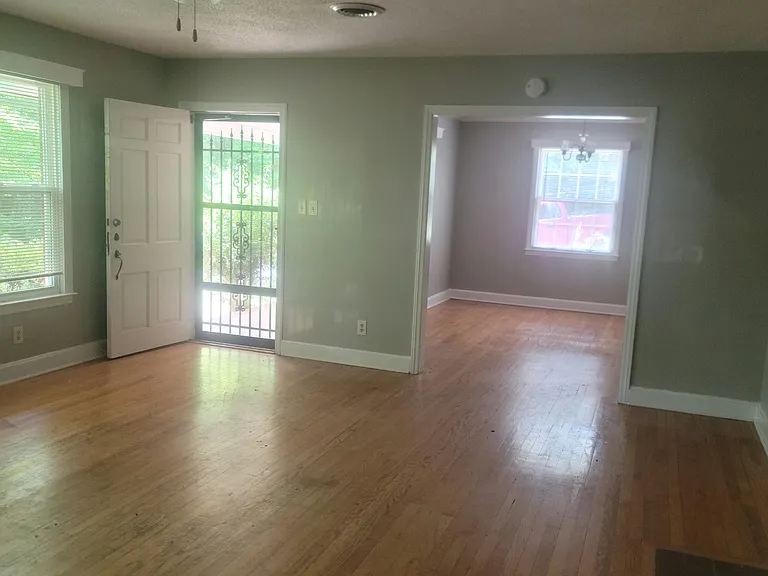 Living Room looking out front door, into dining room