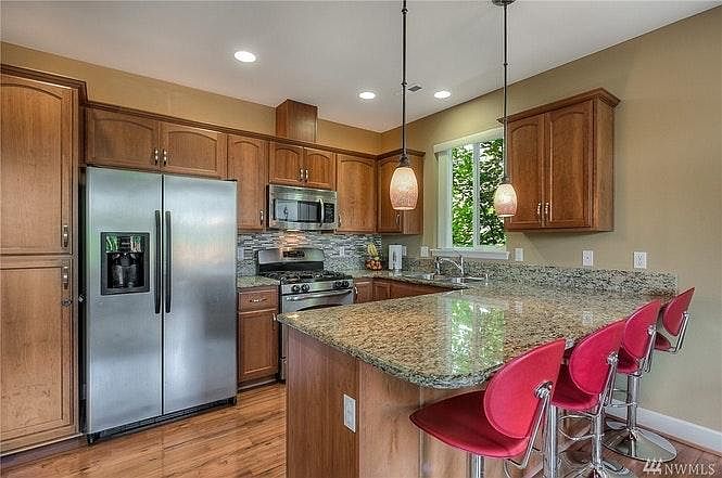 Kitchen with granite counters and stainless steel appliances