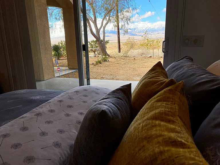 Yellow Bedroom: California King size bed, tall ceiling, walk-in closet, electric fireplace, back yard access, expansive desert and mountain views