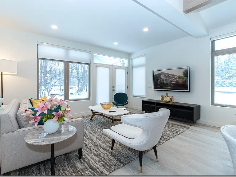 Bright and Open Livingroom Area, with High Ceilings that are Cable and Internet Ready.