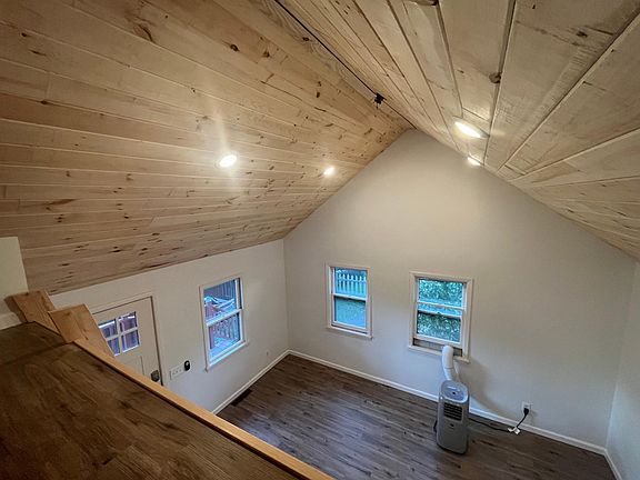 view of living room from loft. door to left is front entry door.