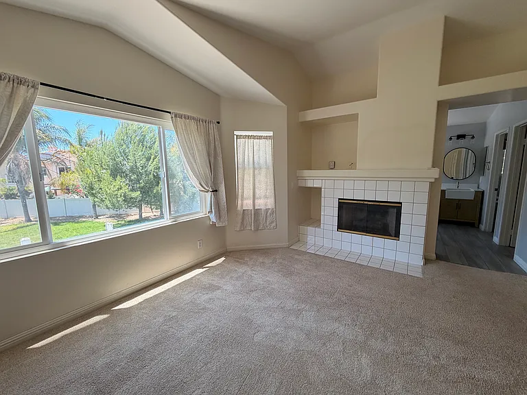Primary bedroom with view of backyard.