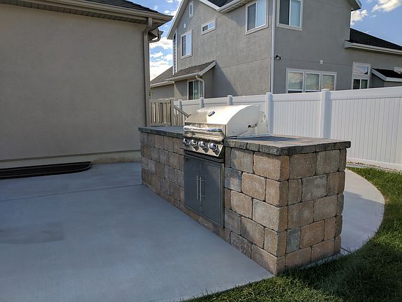 Gas grill in afternoon shade