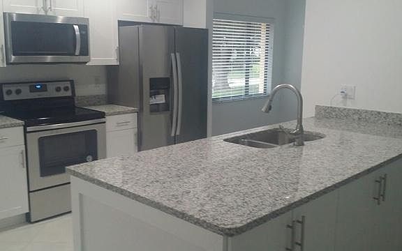 Kitchen with granite countertops and new appliances