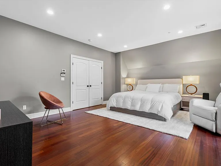 Super sized primary bedroom with terrace overlooking private backyard, large walk-in closet and spa-like bathroom
