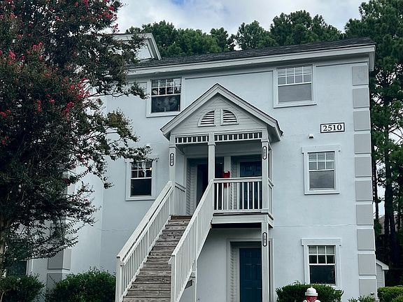 Entrance is the left door and the top of the stairs.