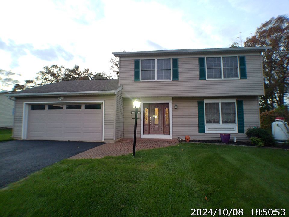 House with 2-car garage and brick front patio