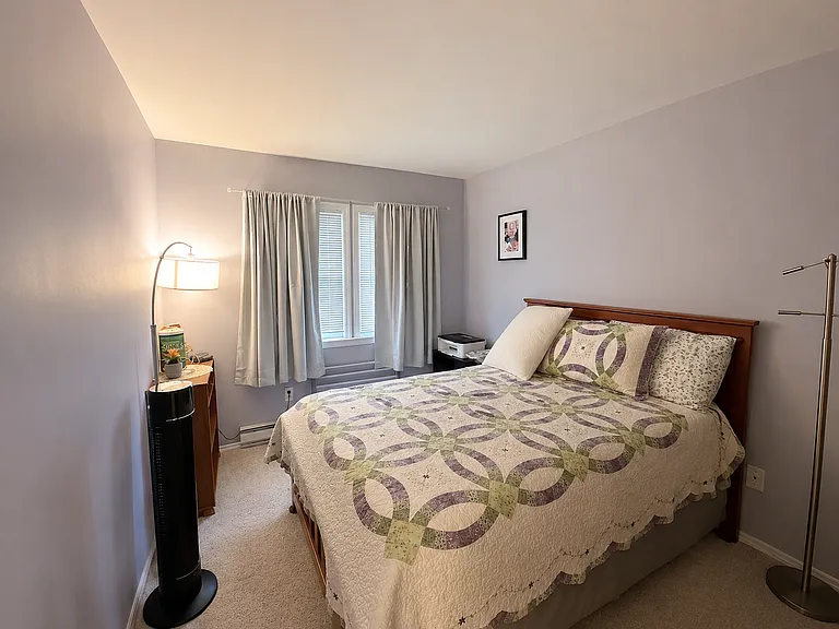 Second bedroom with window and wall-to-wall carpet