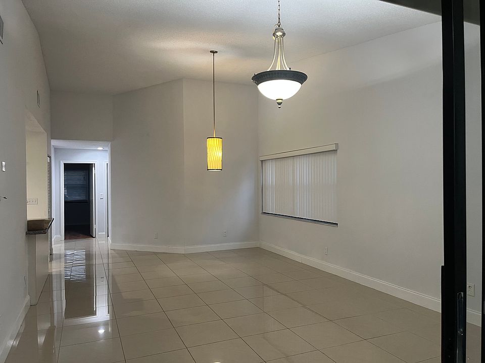 View of living and dining area from the other side (as if you are stepping outside master bedroom)