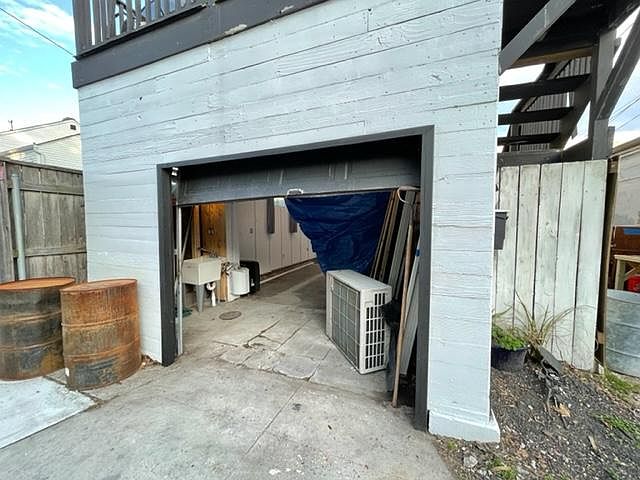 Front of building, rollup garage door.
