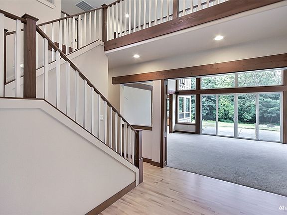 View from entry toward great room, staircase to sky bridge. >