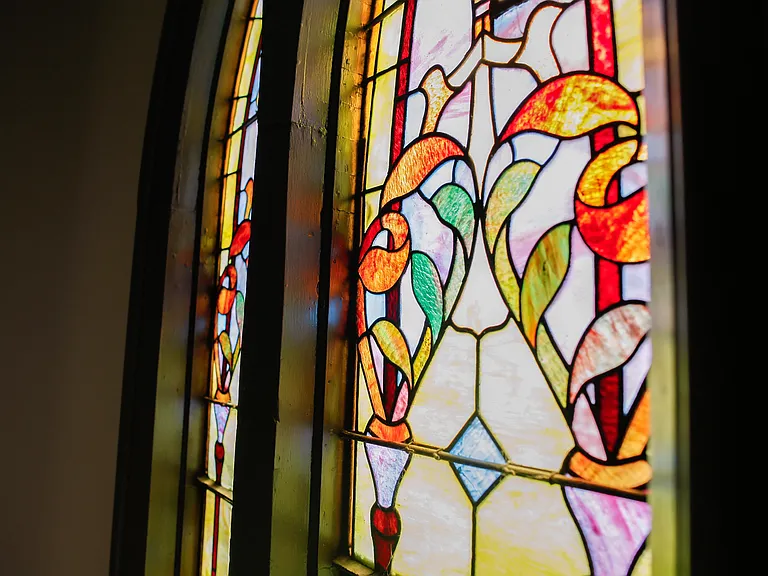Select apartment homes have stunning original stain glass windows