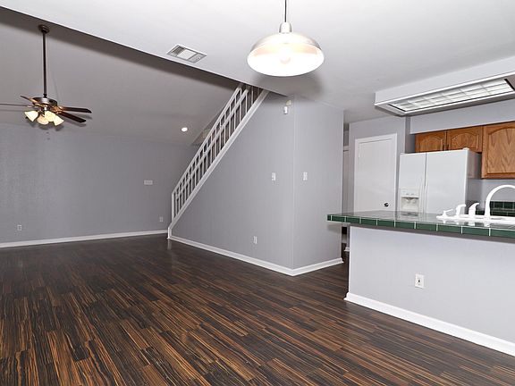 View from dining into living and kitchen/Pantry. Appliances have been updated to stainless since this photo.