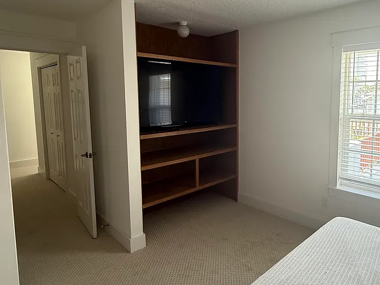 Custom shelves in primary bedroom. Linen closet in hallway. Walk in closet not shown.