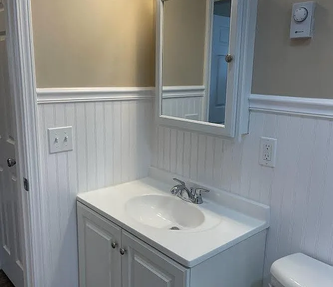 Vanity, sink & medicine cabinet.