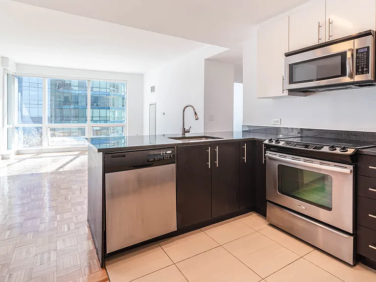 Living Room and Kitchen with Stainless Steel Appliances