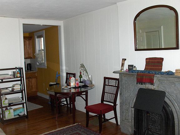living room showing kitchen entrance