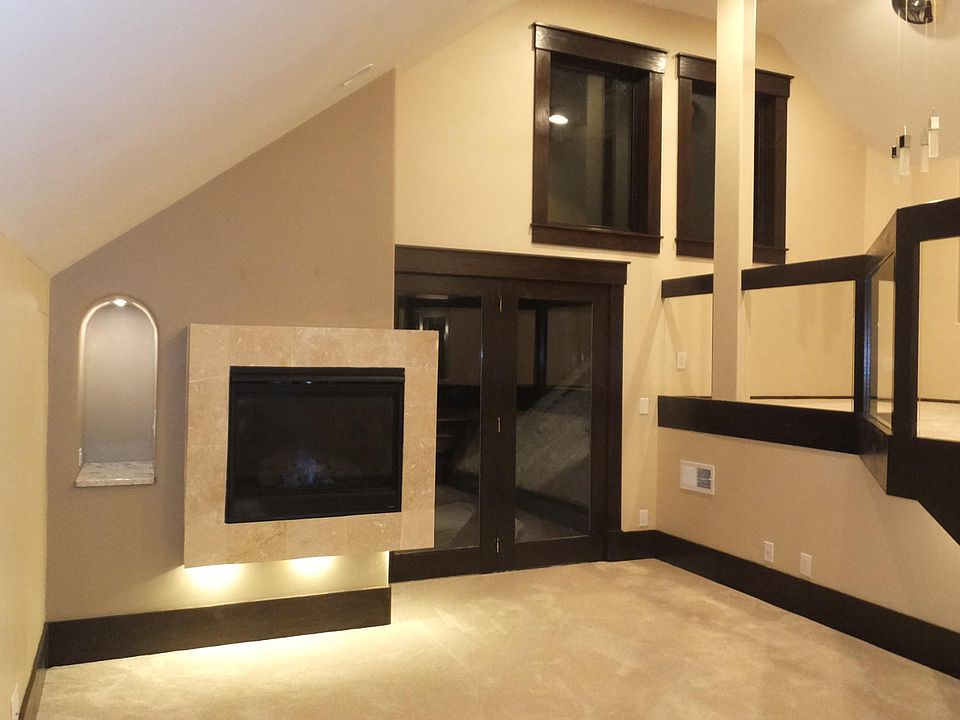 Living Room, Fireplace, Door to Deck, Raised Dining Room