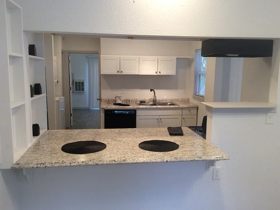 Eat at bar, hall to bedroom, washer/dryer left